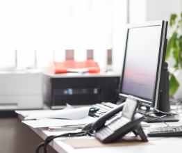Empty desk with a computer and office equipment