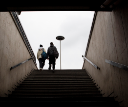 Two young people at the top of an external staircase 